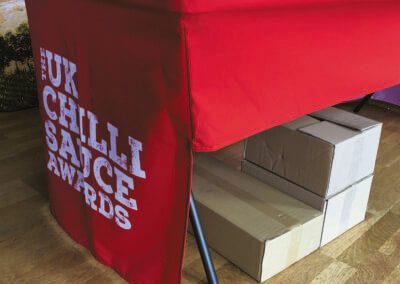 Photograph showing cut away of cloth on back of branded trestle table cover