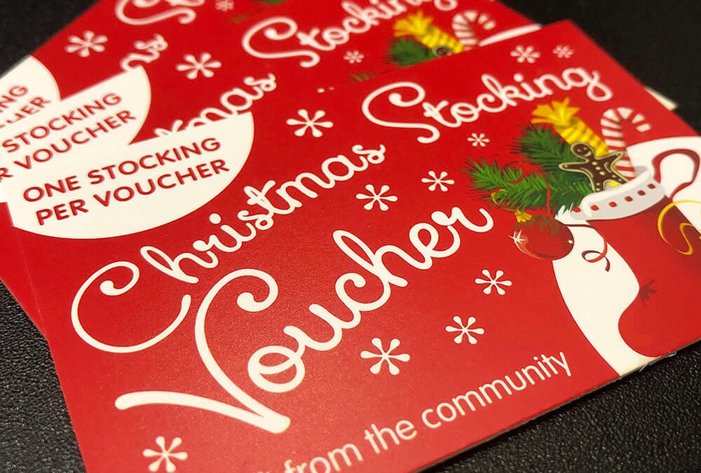 Photograph of Christmas Stocking Vouchers printed on 400gsm silk board with typically use for business cards