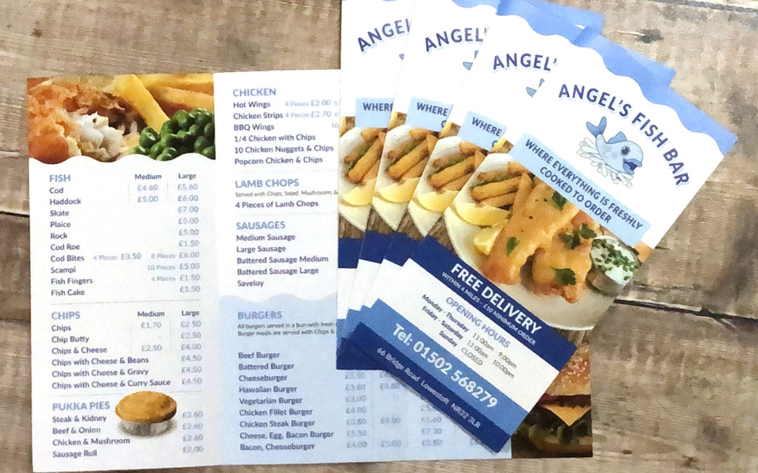 Photograph of Angels Fish Bar Take Away menus on a rustic wooden plank background